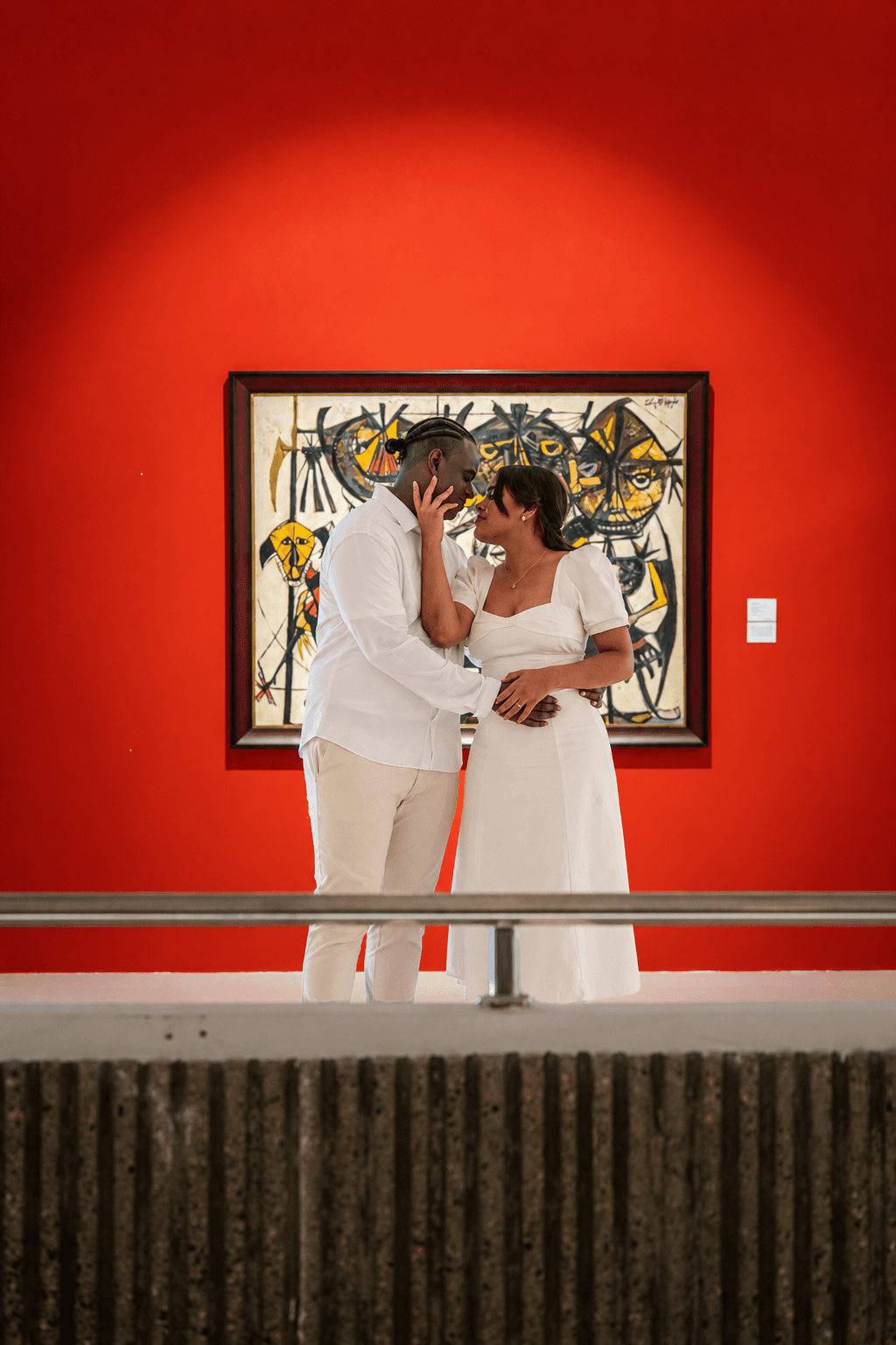 Romantic Couple Beneath Abstract Art